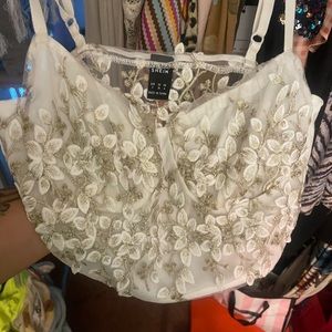 Cute little crop top white and gold. Kind of see through. Very cute.